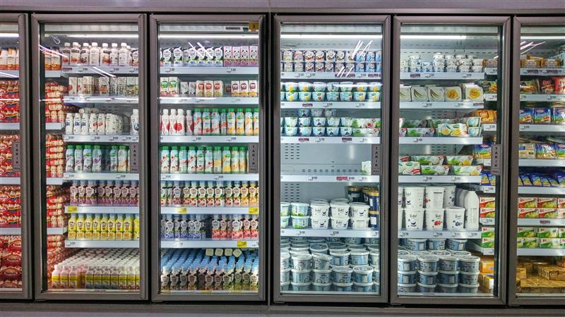 Chilled FMCG products merchandised on supermarket shelves